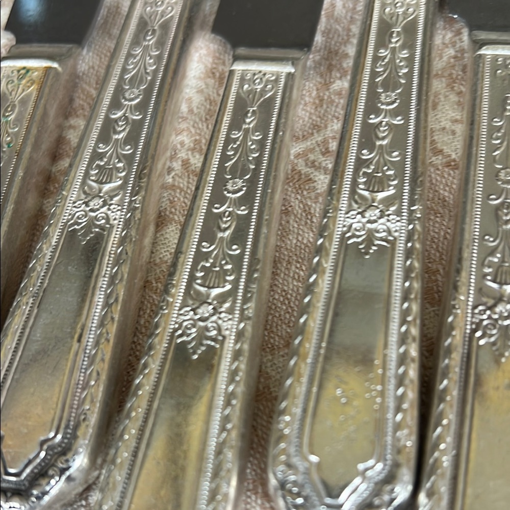 Elegant vintage silver plate dinner knives